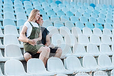 The girl sits in the arms of a guy Stock Photo