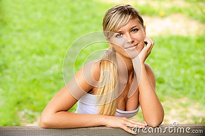 Girl sits on bench Stock Photo