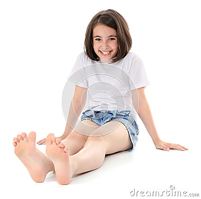 Girl sitting on a floor Stock Photo