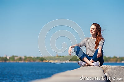 Girl is sitting on a parapet 04 Stock Photo