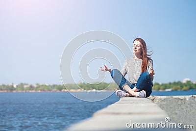 Girl is sitting on a parapet 05 Stock Photo