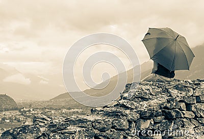 Girl sitting on a wall Stock Photo