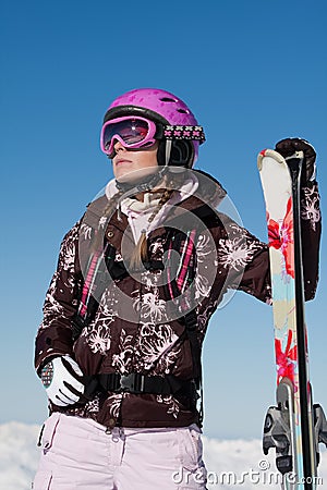 Girl skier with skis Stock Photo