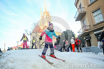 Girl skiing in city center Editorial Stock Photo
