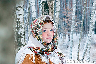 Girl - Slavic appearance wrapped in a scarf in winter Stock Photo