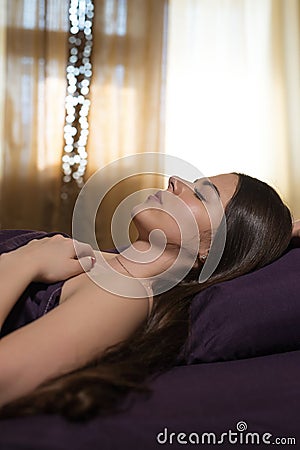 The girl is sleeping in the morning. Morning awakening Stock Photo