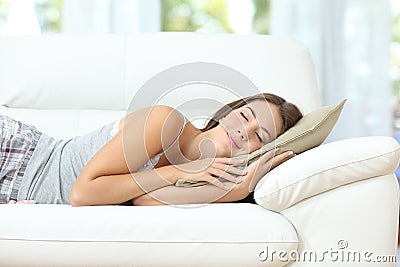 Girl sleeping or napping happy on a couch Stock Photo