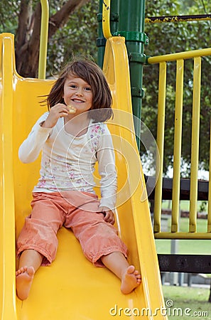 Girl on the slide Stock Photo