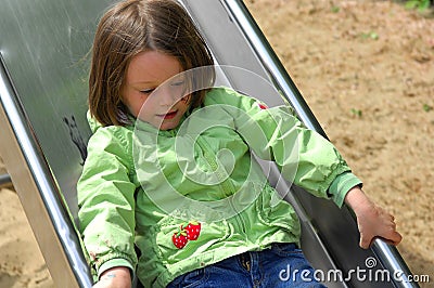 Girl sliding chute Stock Photo