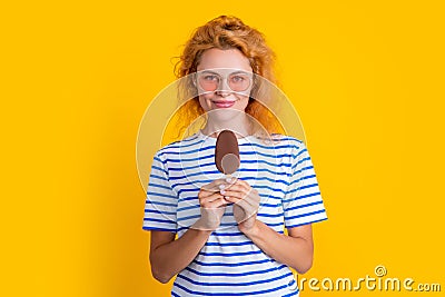 girl smile with icelolly ice cream isolated on yellow. girl with icelolly ice cream in studio. Stock Photo