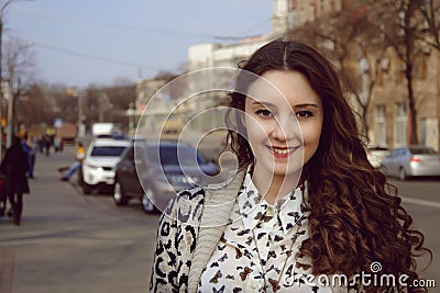 Girl smiling on the background of the city Stock Photo