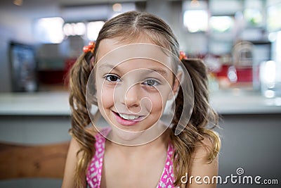 Girl smiling at camera at home Stock Photo