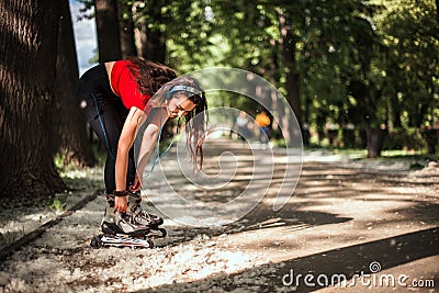 Smiling girl enjoying outdoors while rollerblading Stock Photo