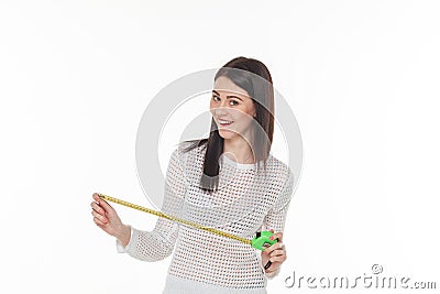 Girl smilling construction tape measure Stock Photo