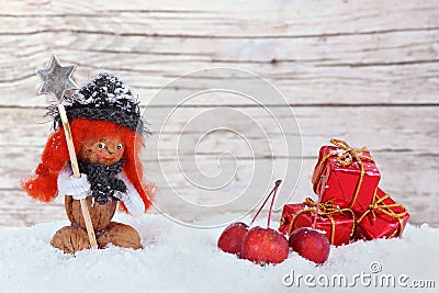 Girl in the snow, little apples and parcels Stock Photo
