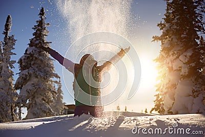 Snowboarder girl with raised arms has fun Stock Photo