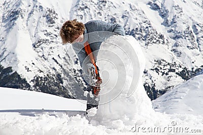 Girl snowman mountains Stock Photo