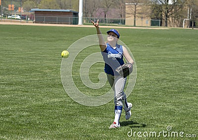 Girl softball pitcher warming up before a game Editorial Stock Photo