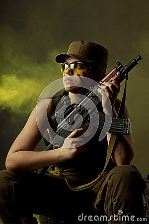 Girl soldiers in the smoke Stock Photo