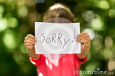 Girl with Sorry sign Stock Photo
