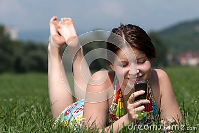 Girl speaks by mobile phone Stock Photo