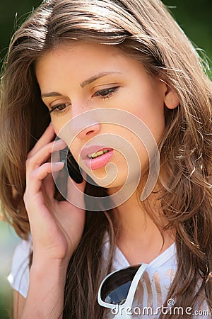 Girl speaks on phone Stock Photo