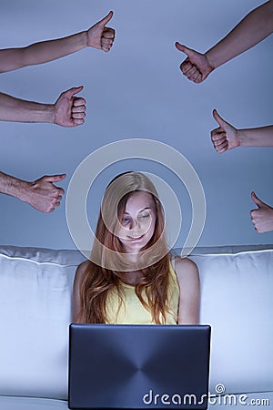 Girl spending time with facebook Stock Photo