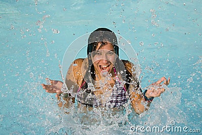 Girl splashing in water Stock Photo