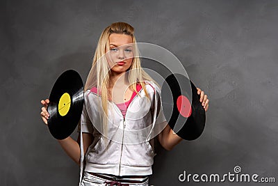 Girl in sports clothes with vinyl Stock Photo
