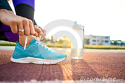 Girl sportsman crossfit and squats agains at sunset Stock Photo