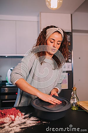 A girl spreading oil in a fountain Stock Photo