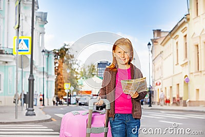 Girl stand alone on the street with city map Stock Photo