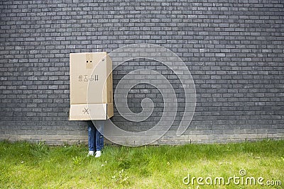 Girl standing against a wall Stock Photo