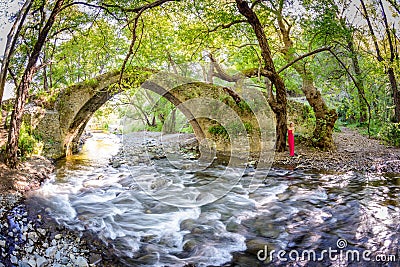 A girl standing by kelefos bridge,cyprus Stock Photo