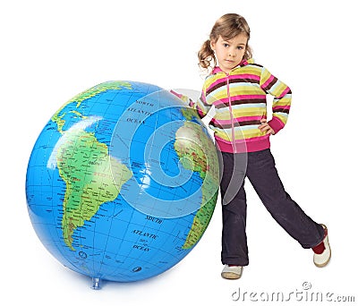 Girl standing near big inflatable globe Stock Photo