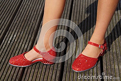 Girl standing in red dancing shoes Stock Photo