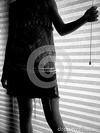 Girl standing in silhouette Stock Photo