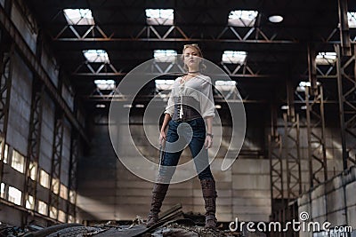 Girl in a steampunk costume at an abandoned factory Stock Photo