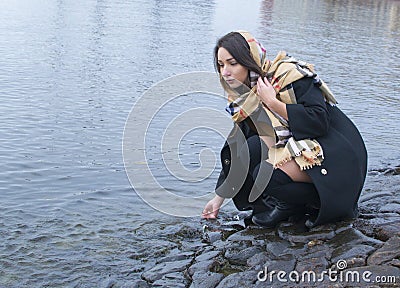 Girl stone bridge at the river Stock Photo