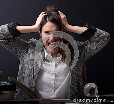 Girl student with books and magnifying glass. Stock Photo