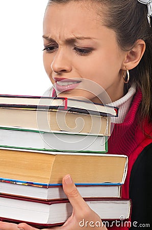 Girl student carrying heavy books Stock Photo