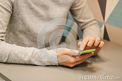 A girl or student uses a mobile phone to call or send a message or use mobile applications or the Internet to access the Stock Photo