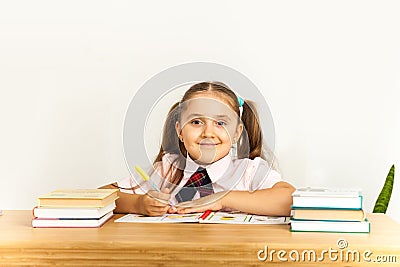 Girl studing at table on white background Stock Photo