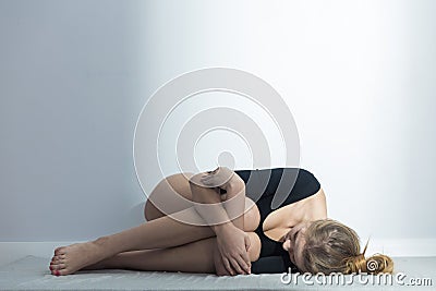 Girl suffering from menstrual cramps Stock Photo
