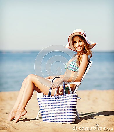 Girl sunbathing on the beach chair Stock Photo