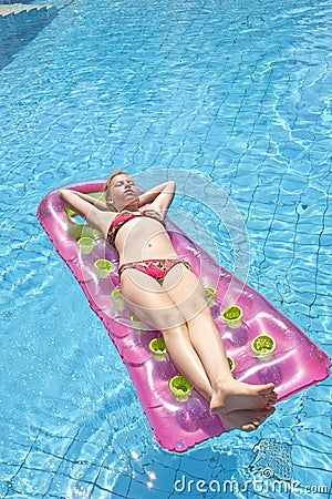 Girl sunbathing on a mattress Stock Photo