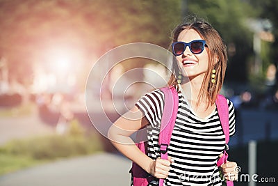 Girl In Sunglasses Smiling And Walking Stock Photo