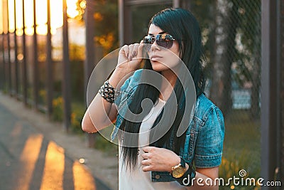 Girl in sunglasses. sun rays sunset Stock Photo