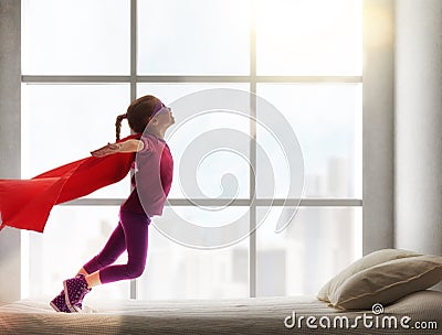 Girl in an Superman's costume Stock Photo