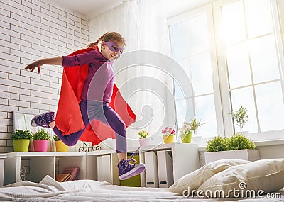 Girl in an Superman's costume Stock Photo